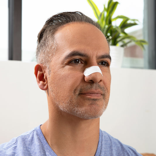 A man with white nasal strips