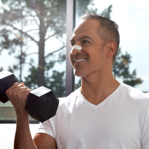 Man exercising with nasal strip on his nose